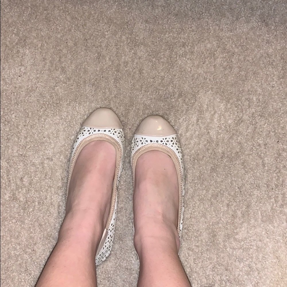 White and tan designed flats